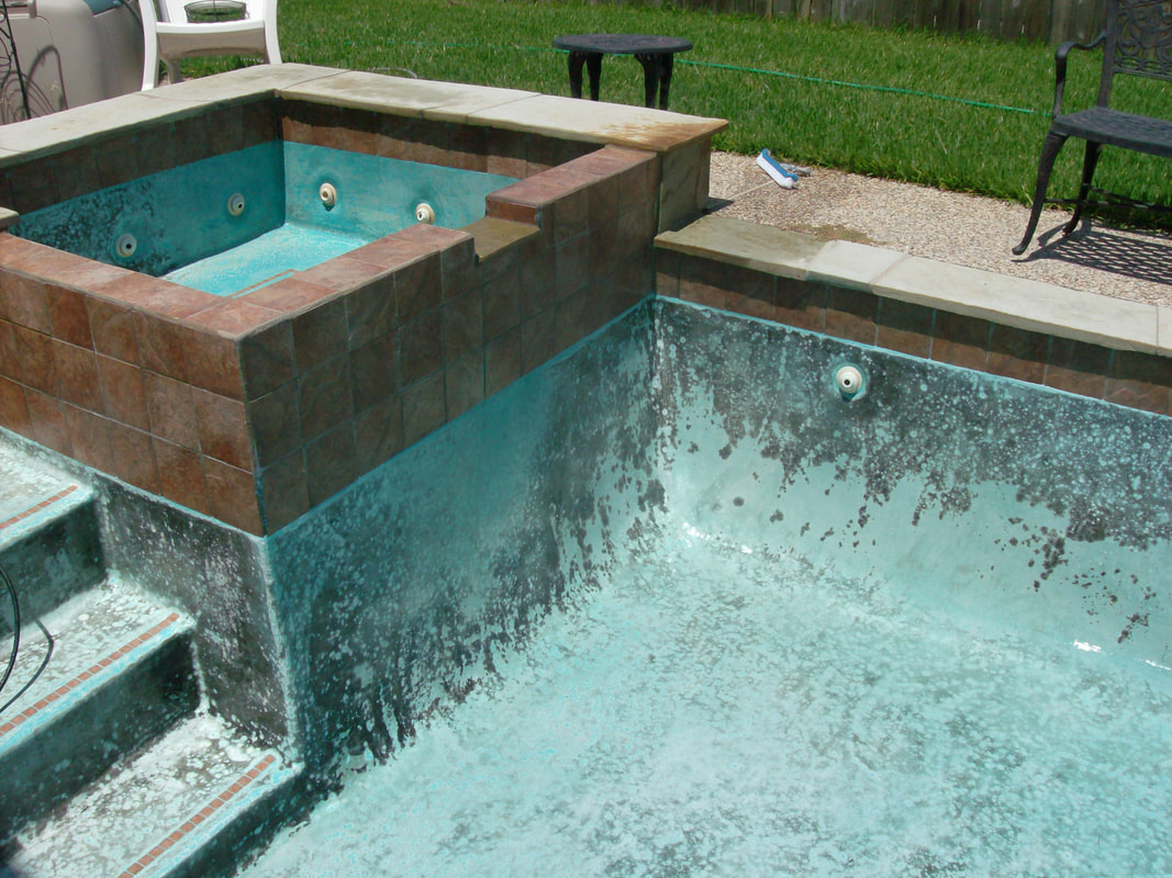 Pool that is in need of acid washing, has dirt and grime build up on all surfaces